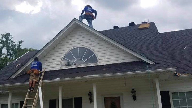 KEE roofer repairing a roof